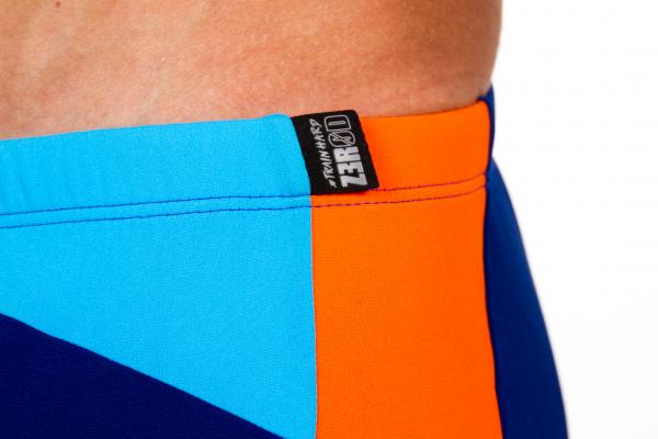 Man dark blue atoll orange swim trunks | Z3R0D